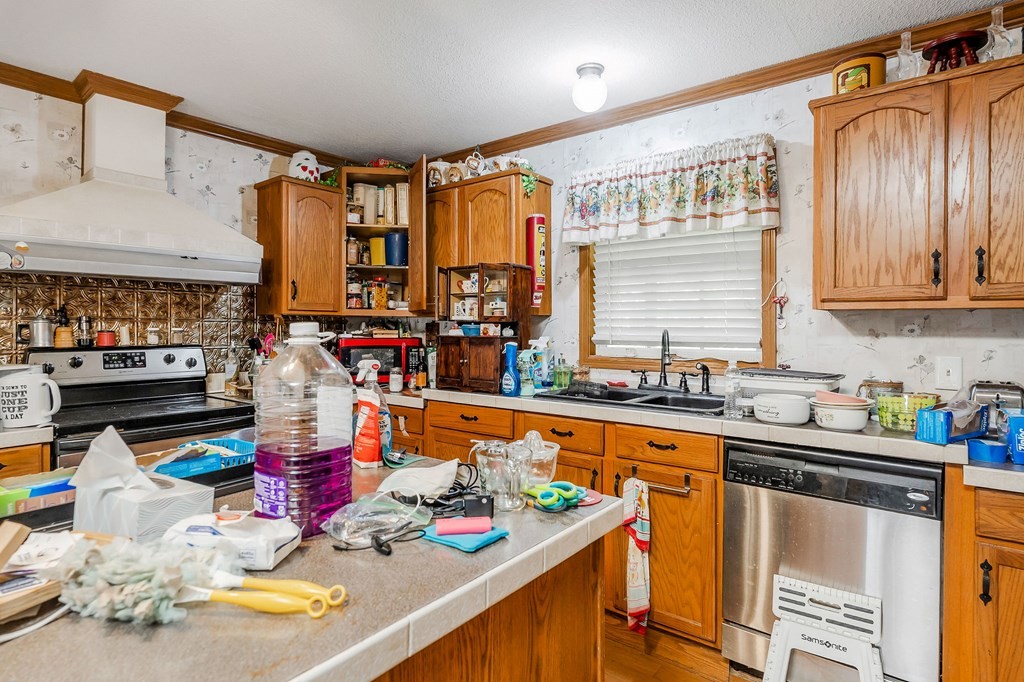 30211 White Oak Road Crawford, TN 38554 - Photo 14 of 24 a kitchen with stainless steel appliances granite countertop a sink stove and cabinets