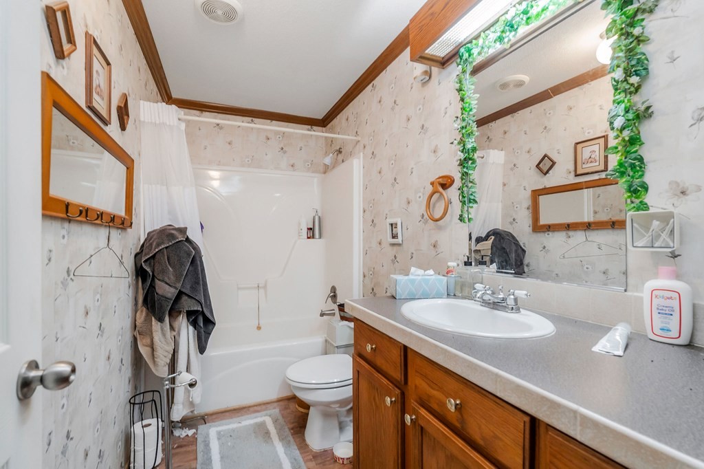 30211 White Oak Road Crawford, TN 38554 - Photo 20 of 24 a bathroom with a toilet sink and mirror