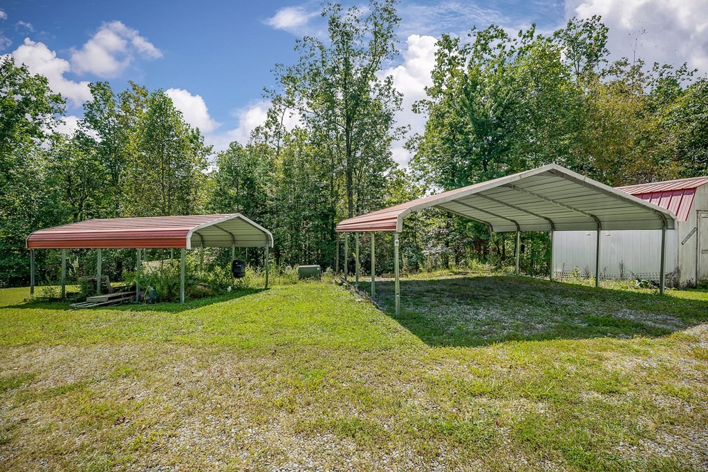 30211 White Oak Road Crawford, TN 38554 - Photo 7 of 24 a view of a house with a yard and sitting area