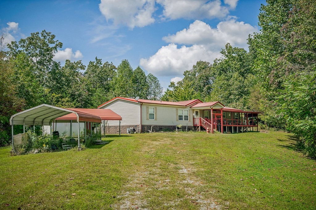 30211 White Oak Road Crawford, TN 38554 - Photo 9 of 24 a house with swimming pool in front of it