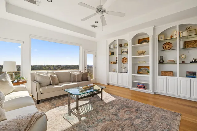a living room with furniture and a rug