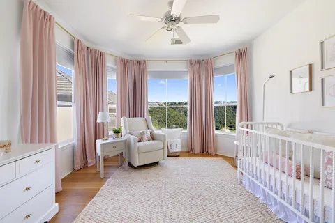 a living room with furniture and windows