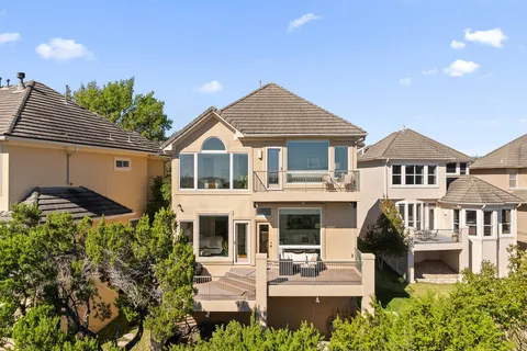 a front view of a house with a yard and porch