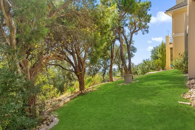 a view of backyard with green space