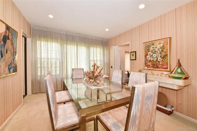 a view of a dining room with furniture window and outside view