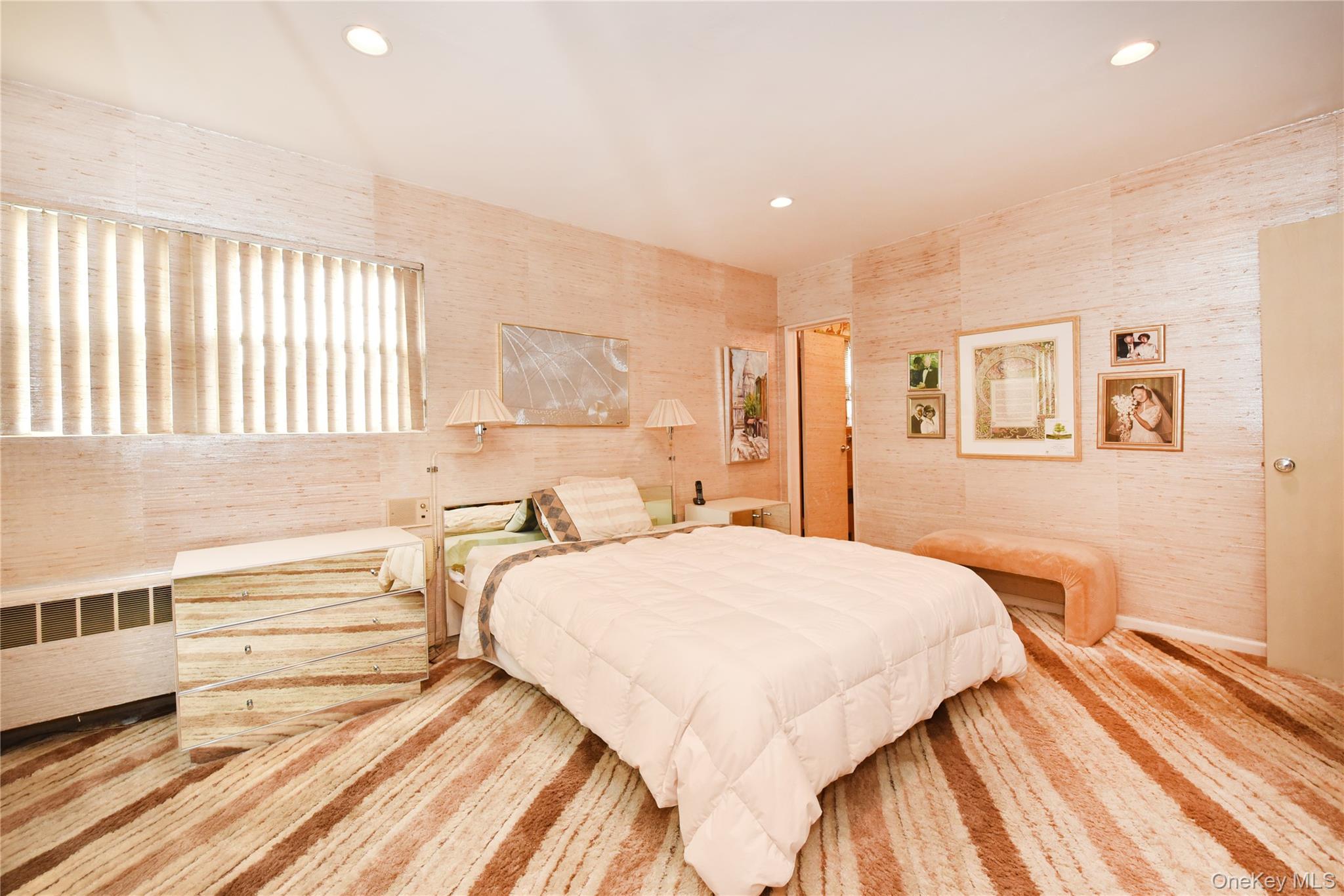 217-49 Stewart Road Queens, NY 11364 - Photo 20 of 27 a bedroom with a bed and a large window