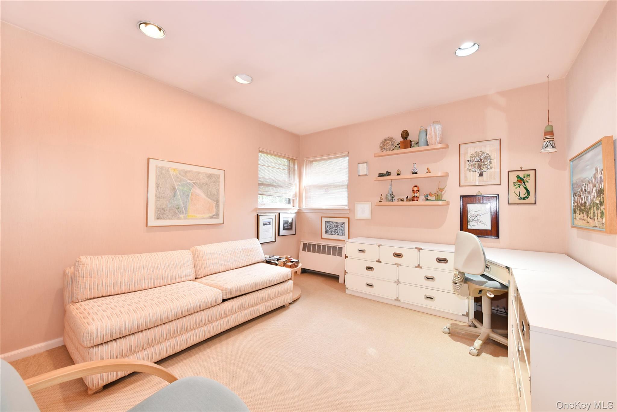 217-49 Stewart Road Queens, NY 11364 - Photo 23 of 27 a living room with furniture and a dresser with rug