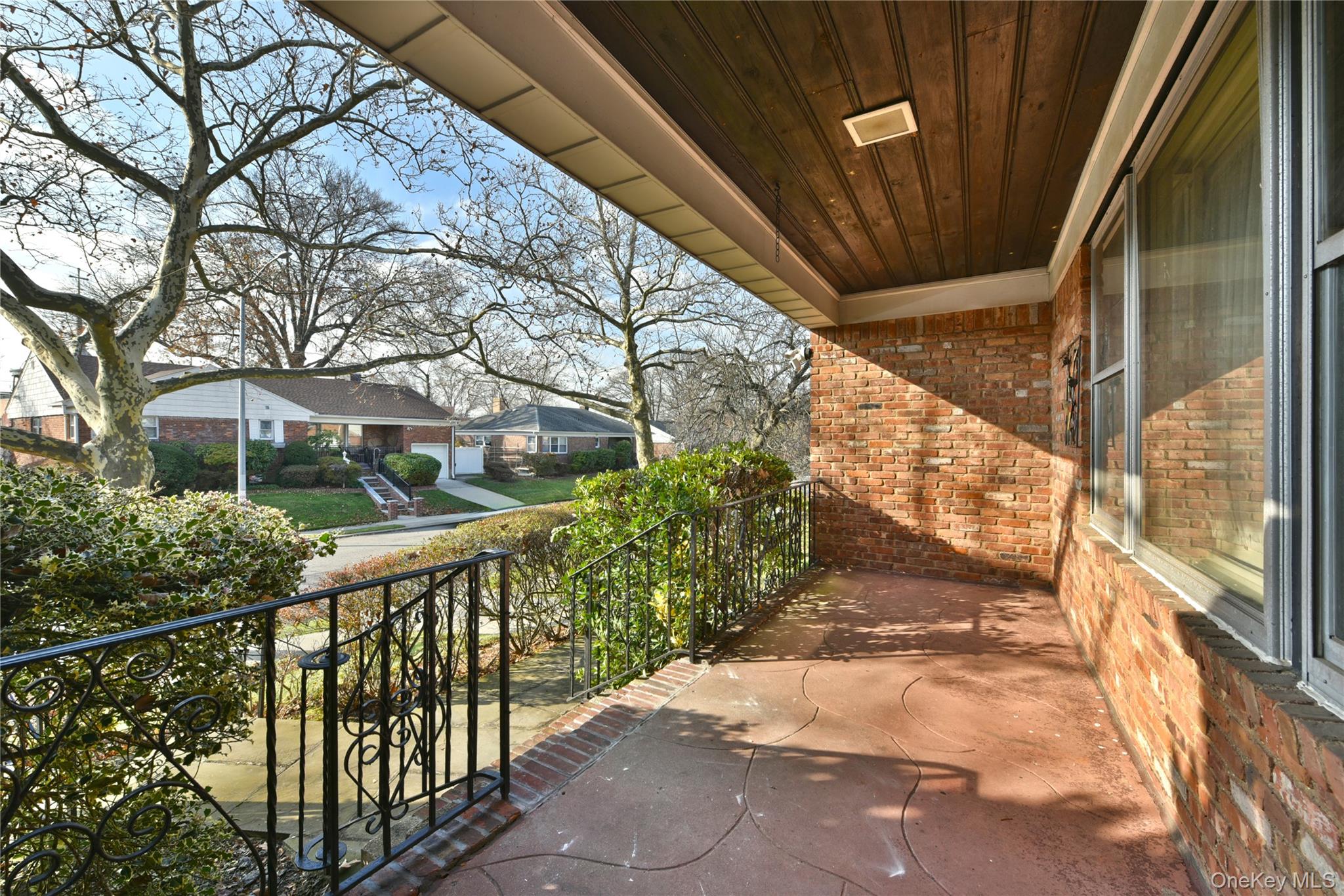 217-49 Stewart Road Queens, NY 11364 - Photo 5 of 27 a view of balcony with wooden floor