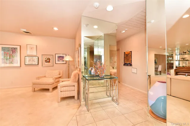 a living room with fireplace furniture and a table