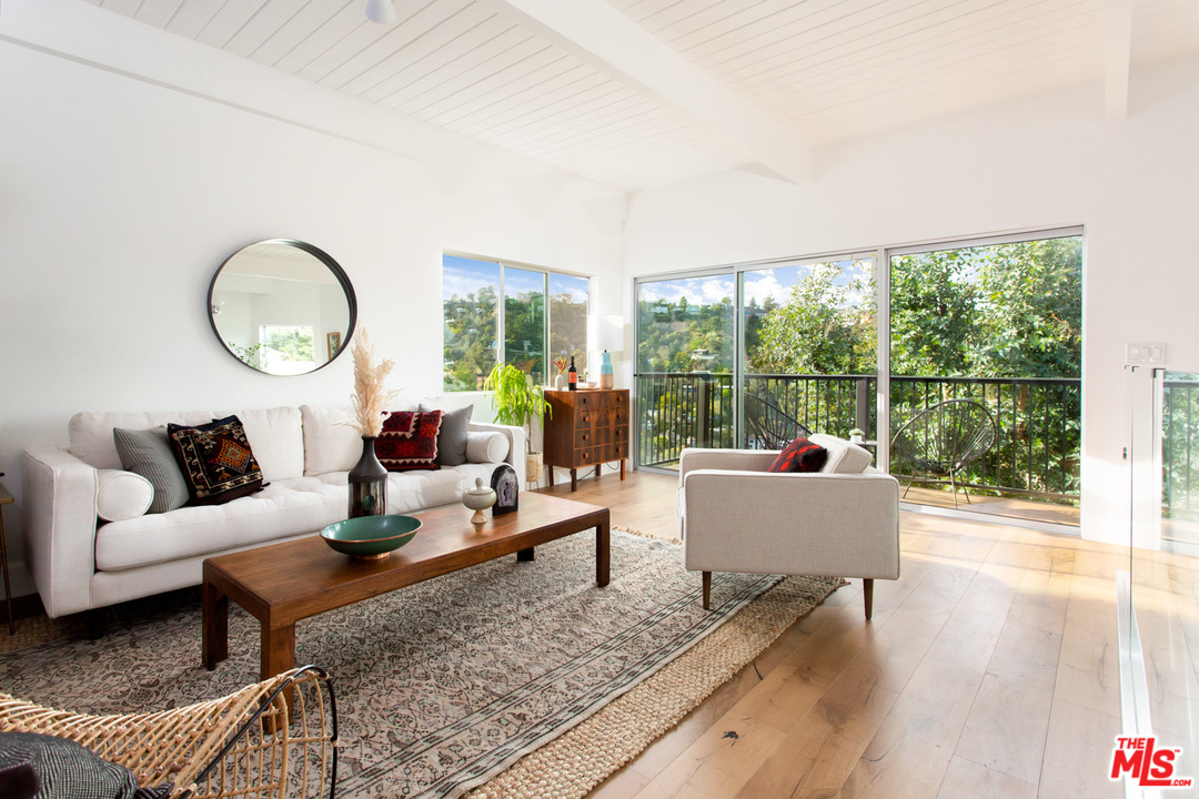 8321 Grand View Drive Los Angeles, CA 90046 - Photo 3 of 28 a living room with furniture and a wooden floor