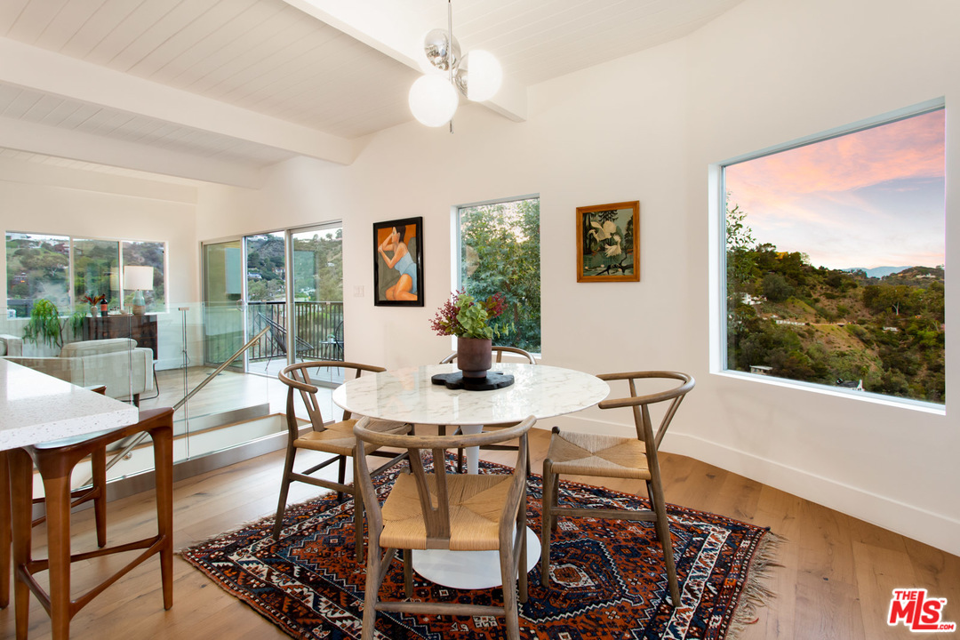 8321 Grand View Drive Los Angeles, CA 90046 - Photo 6 of 28 a view of a dining room with furniture window and outside view