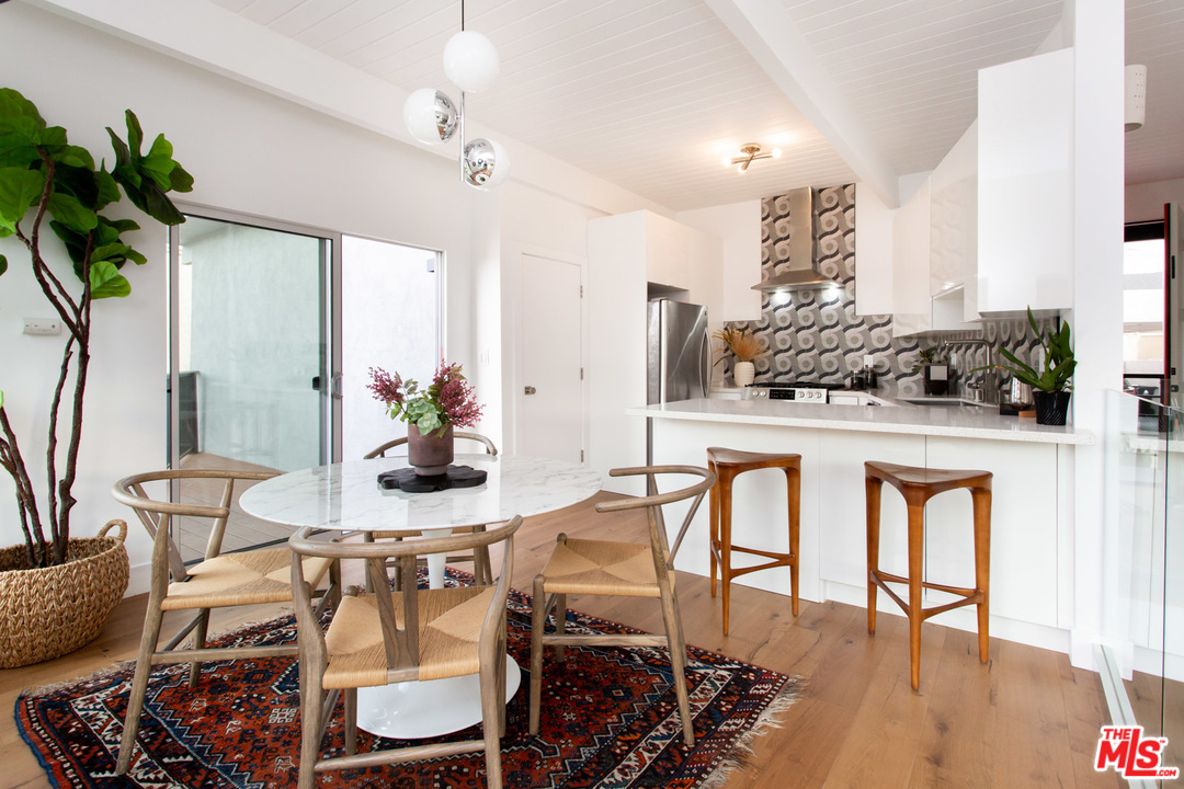 8321 Grand View Drive Los Angeles, CA 90046 - Photo 7 of 28 a dining room with furniture and wooden floor