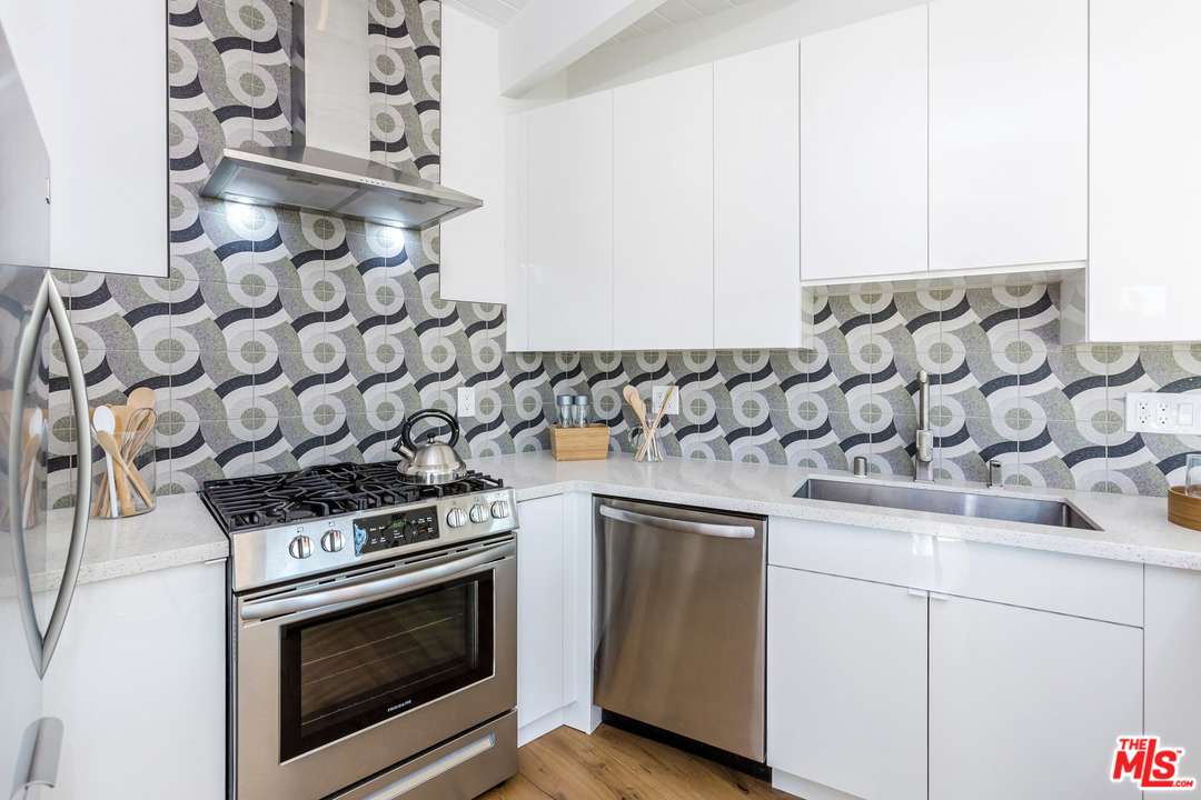 8321 Grand View Drive Los Angeles, CA 90046 - Photo 9 of 28 a stove top oven sitting inside of a kitchen