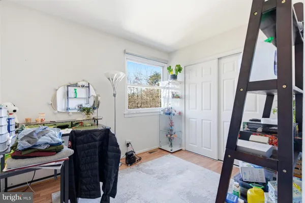 a view of an entryway with workspace and bedroom