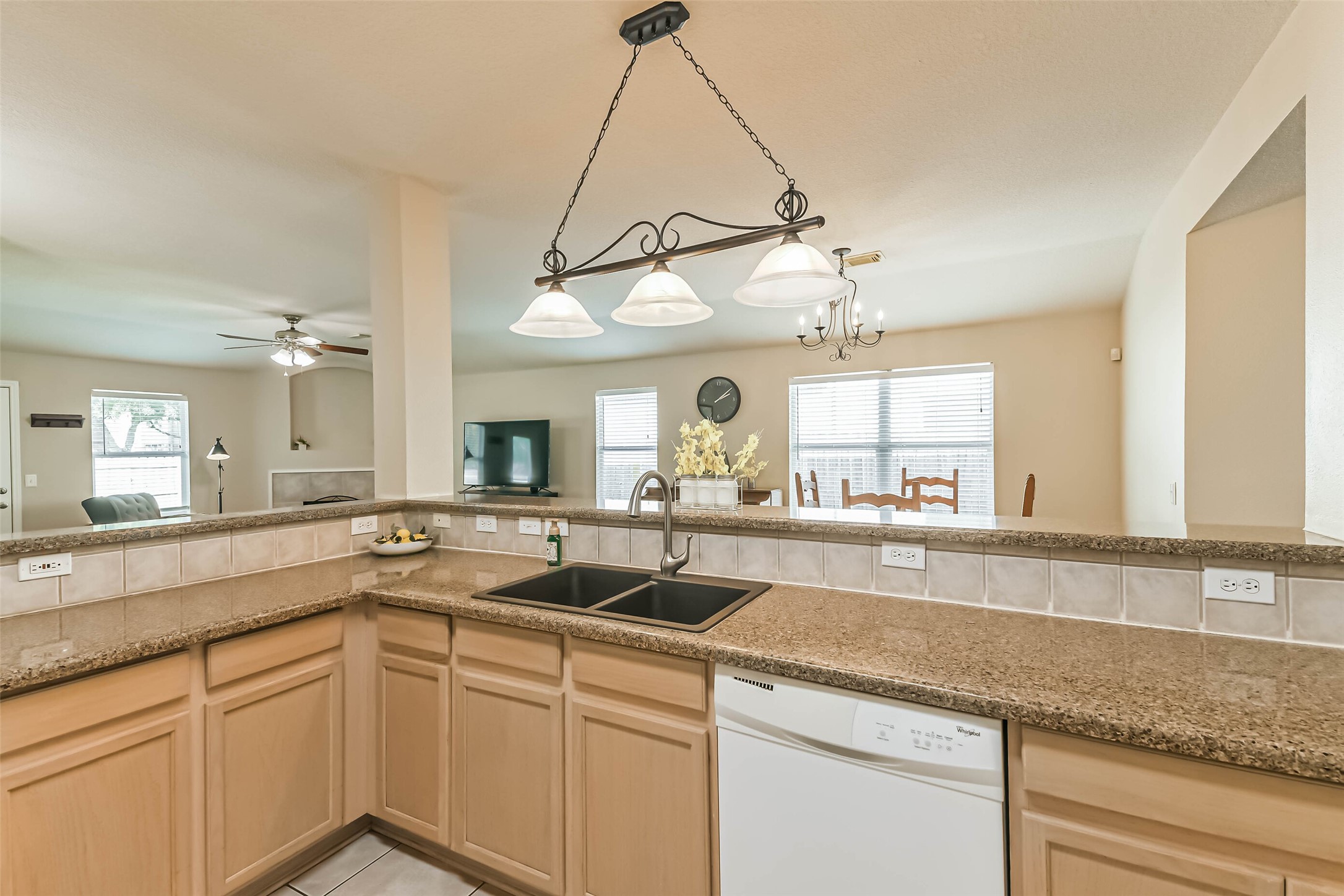 18239 Trinity Knoll Way Humble, TX 77346 - Photo 16 of 38 a kitchen with a sink and a window