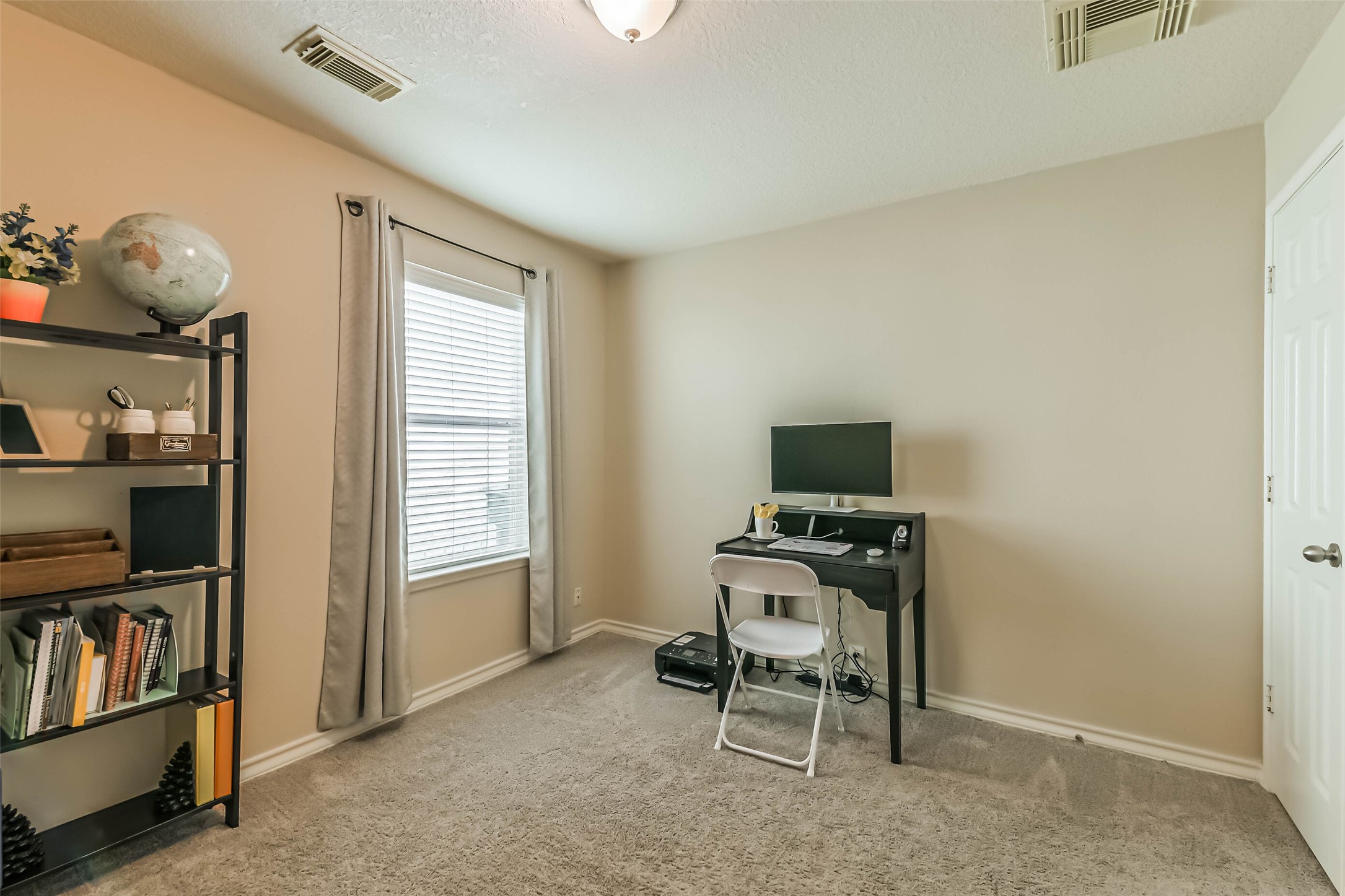 18239 Trinity Knoll Way Humble, TX 77346 - Photo 22 of 38 a living room with furniture a piano and a window