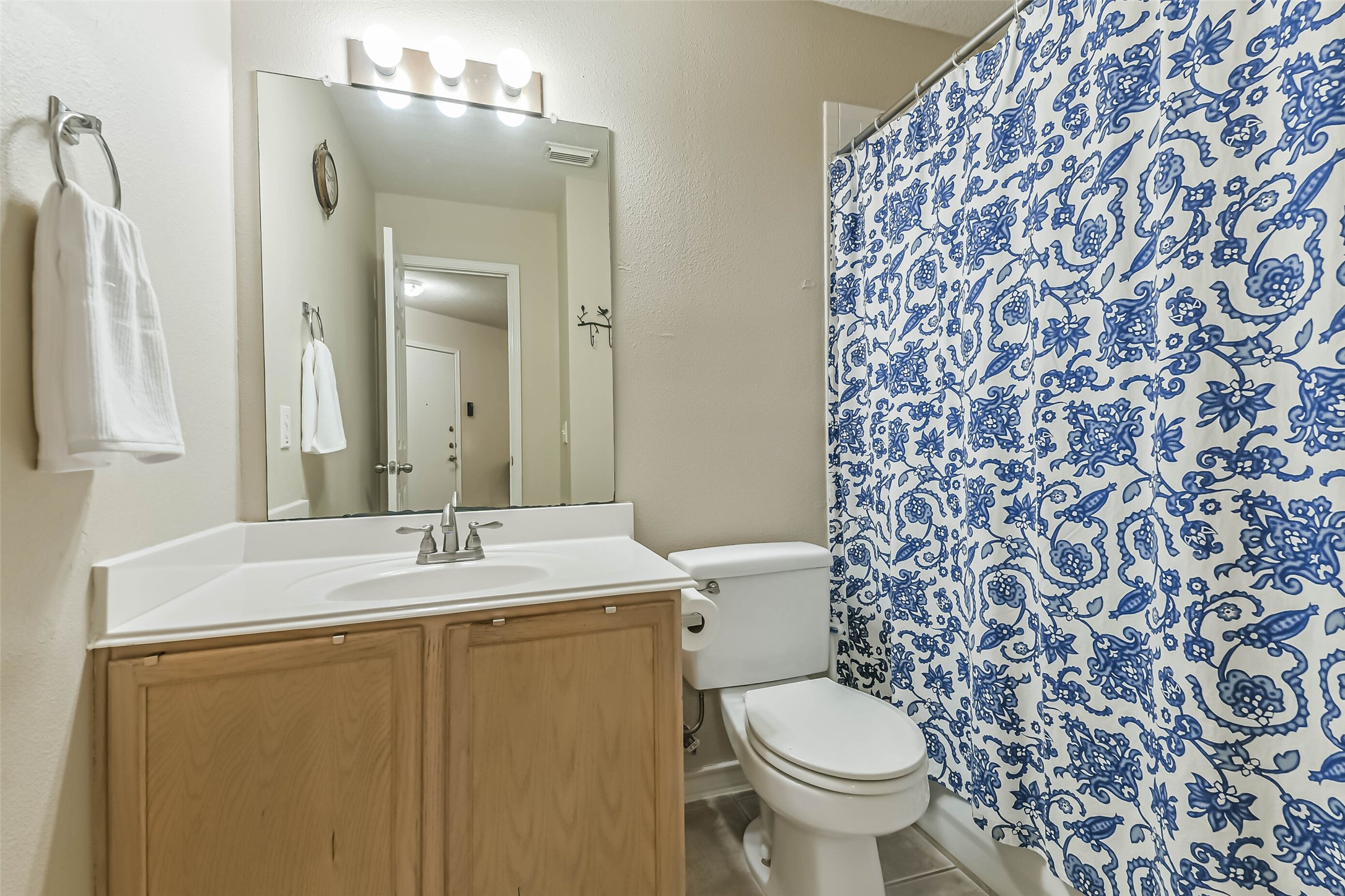 18239 Trinity Knoll Way Humble, TX 77346 - Photo 26 of 38 a bathroom with a granite countertop sink toilet and a mirror