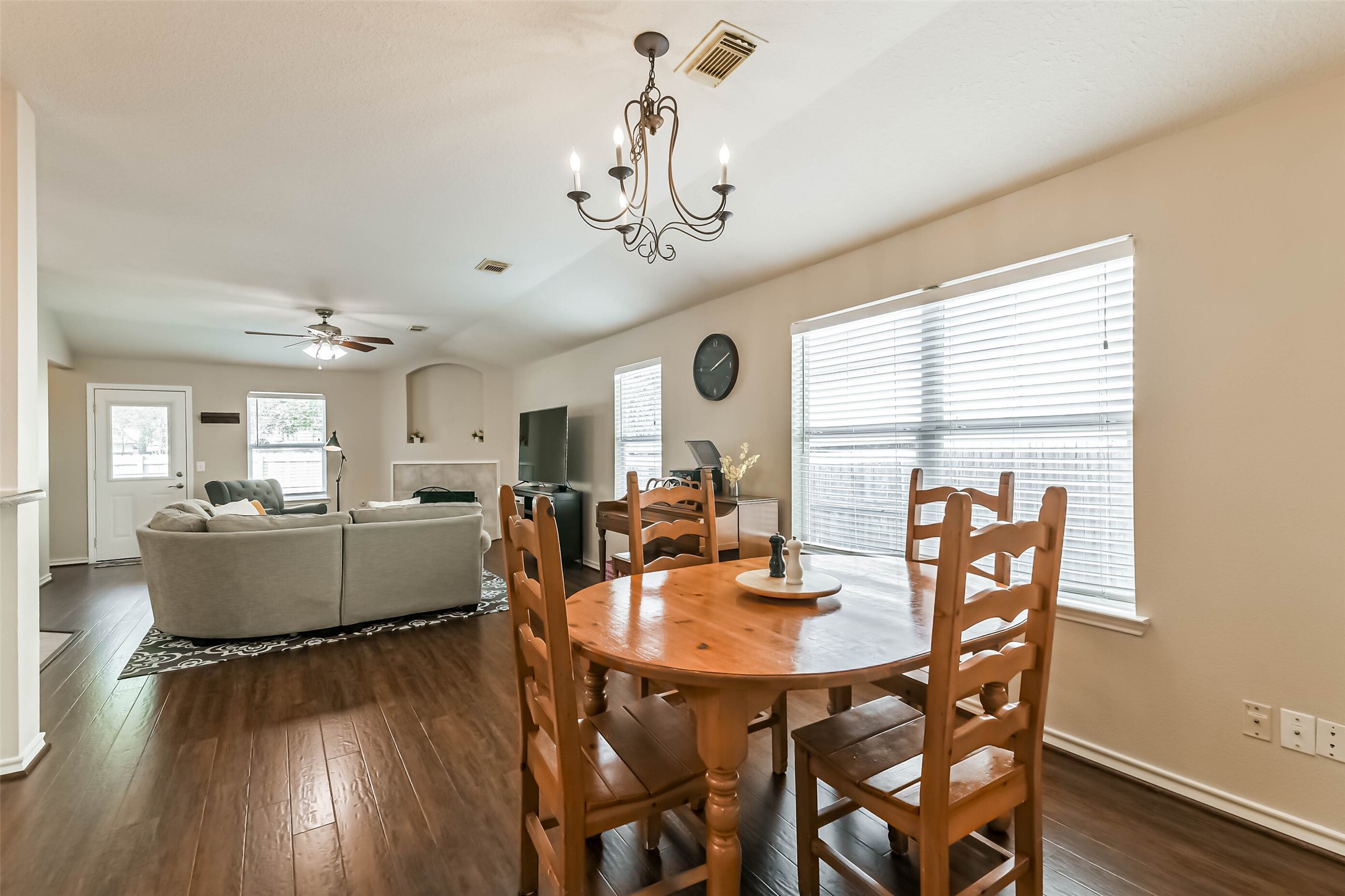 18239 Trinity Knoll Way Humble, TX 77346 - Photo 3 of 38 a view of a dining room with furniture window and wooden floor
