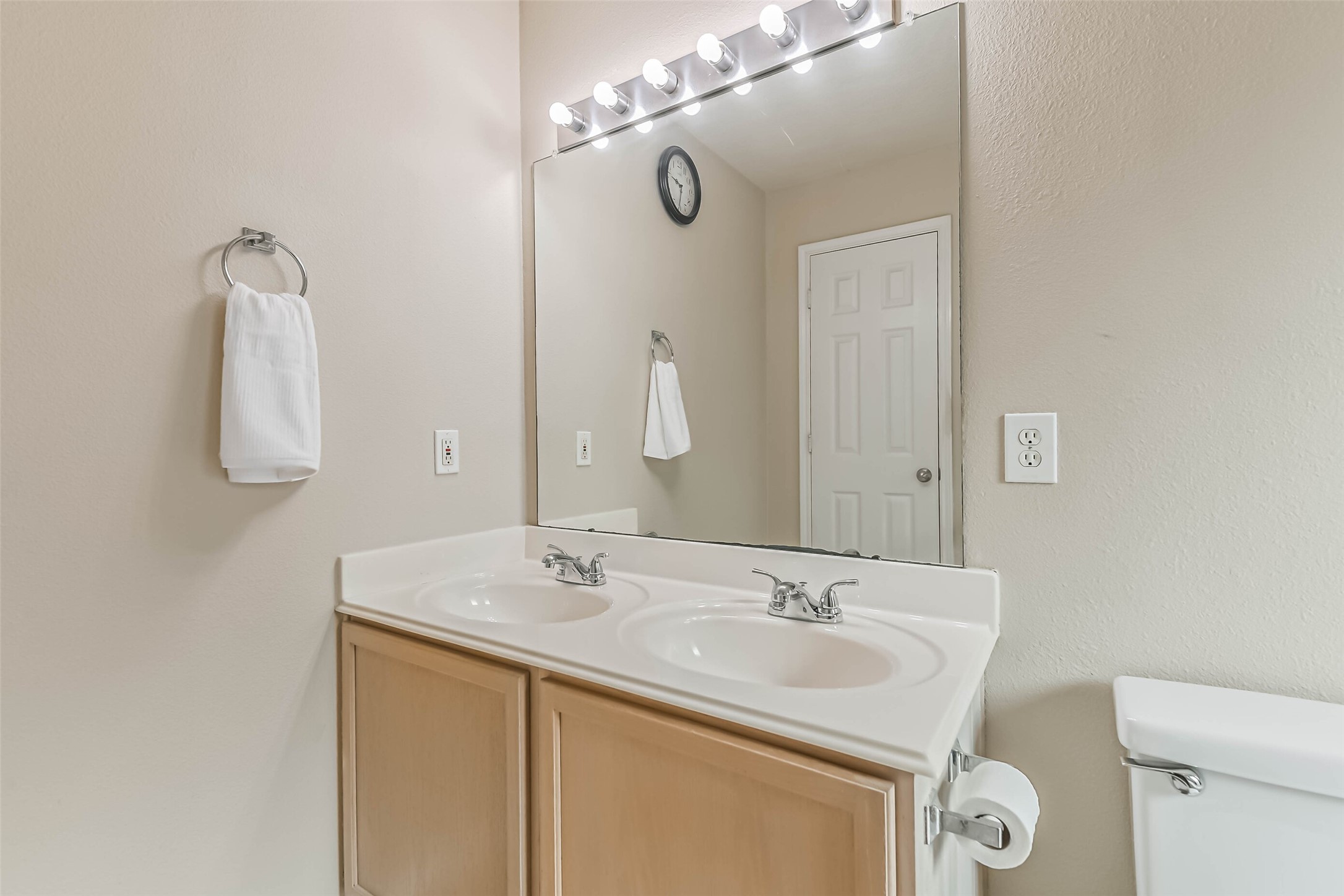 18239 Trinity Knoll Way Humble, TX 77346 - Photo 37 of 38 a bathroom with a sink and a mirror