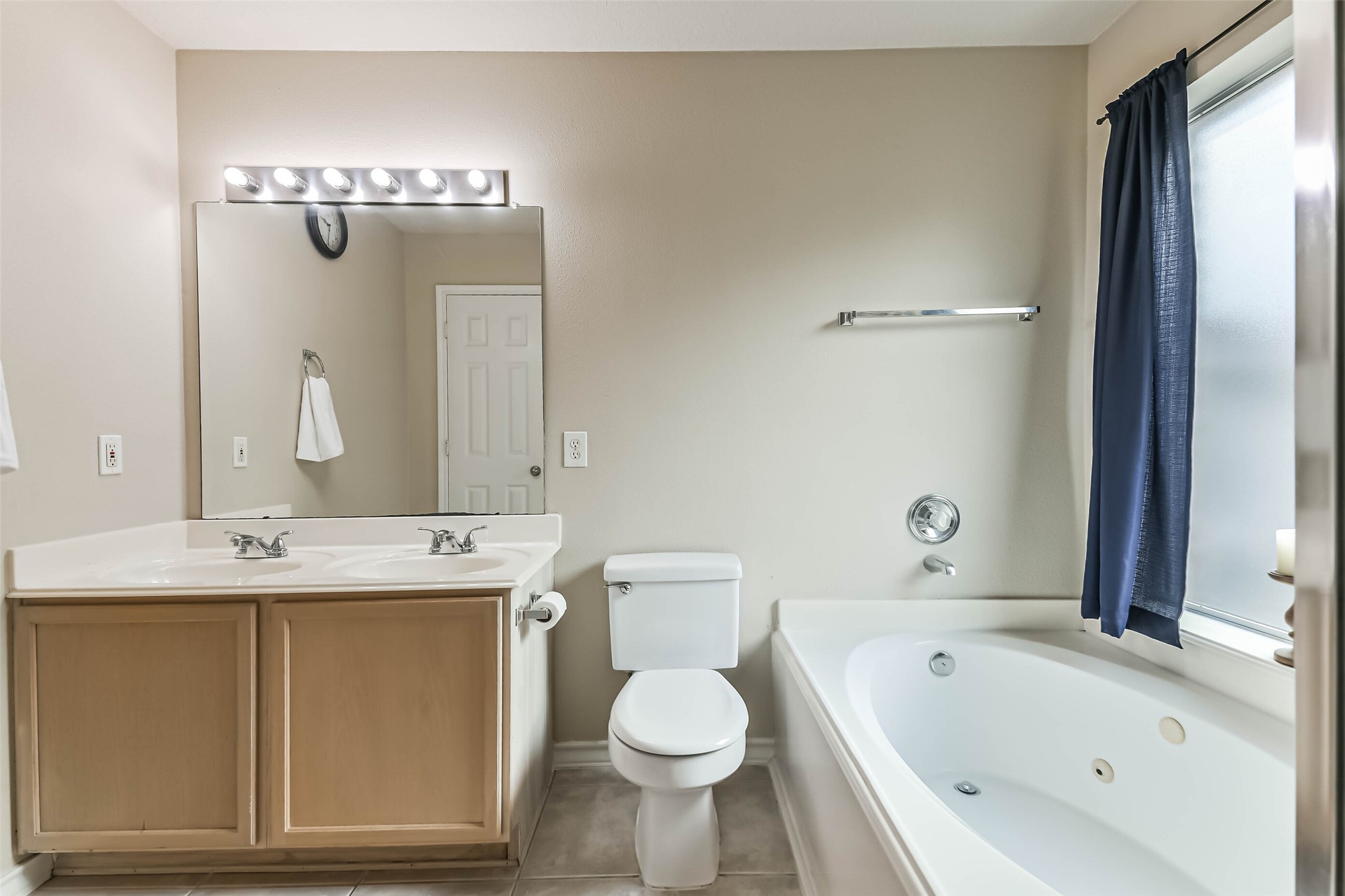 18239 Trinity Knoll Way Humble, TX 77346 - Photo 38 of 38 a bathroom with a sink a toilet and bathtub