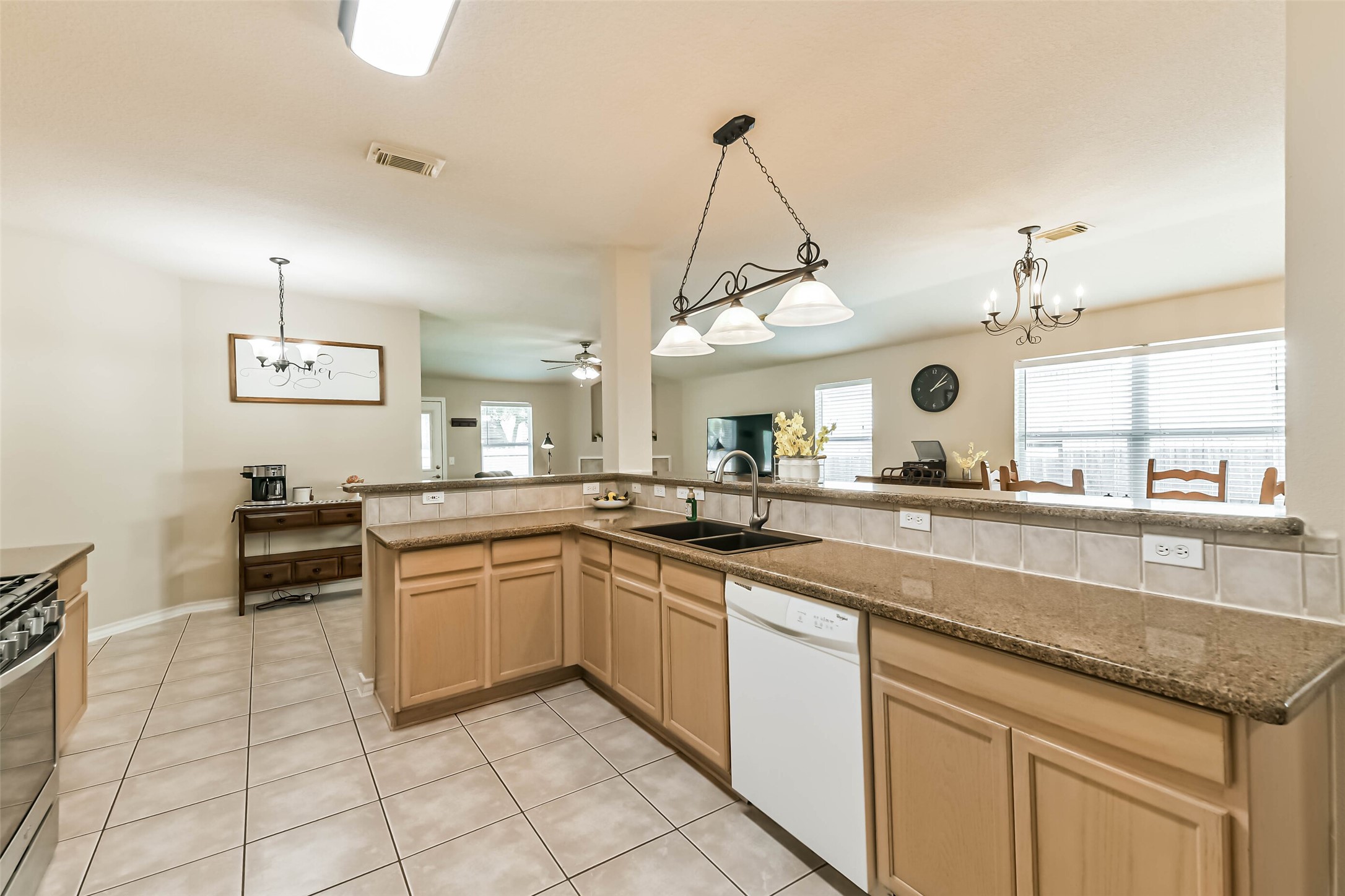 18239 Trinity Knoll Way Humble, TX 77346 - Photo 4 of 38 a kitchen with a sink window and cabinets