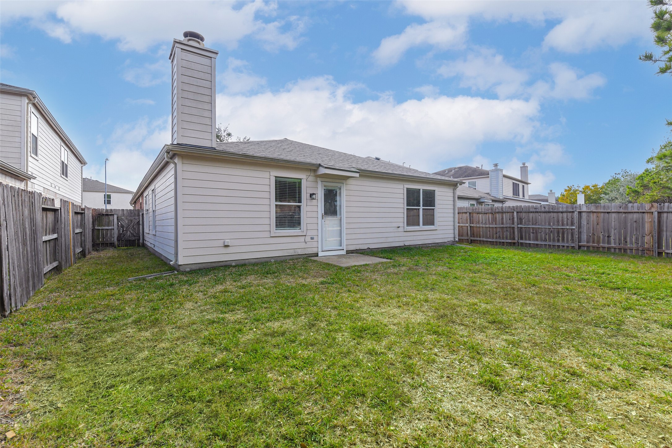 18239 Trinity Knoll Way Humble, TX 77346 - Photo 9 of 38 a view of a backyard with garden
