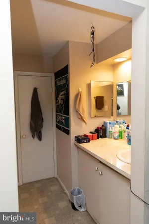 a white toilet sitting next to a shower curtain