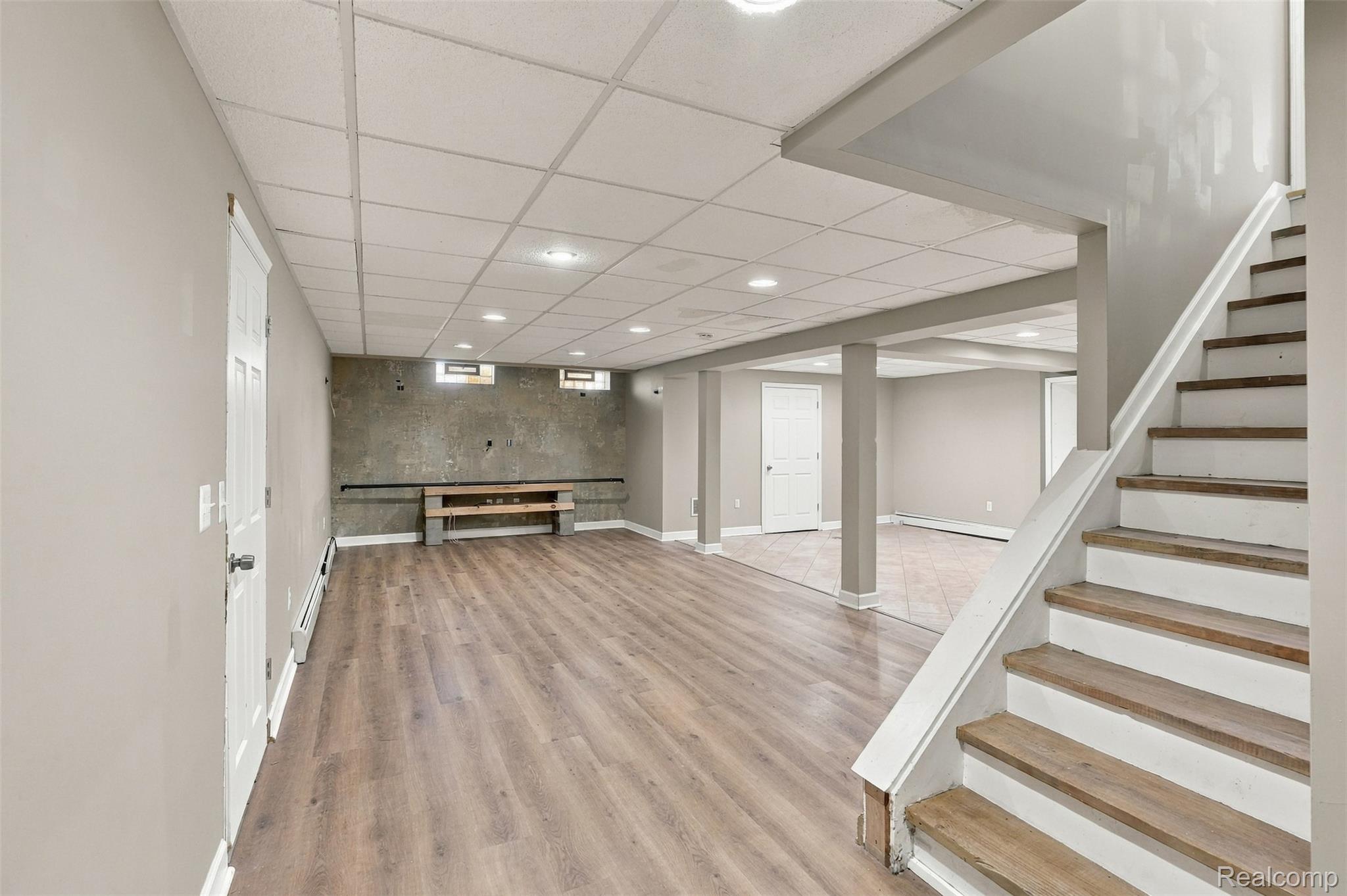 26516 Romine Road New Boston, MI 48164 - Photo 32 of 62 Expansive lower level with wood-finish flooring, recessed lighting, and a drop ceiling