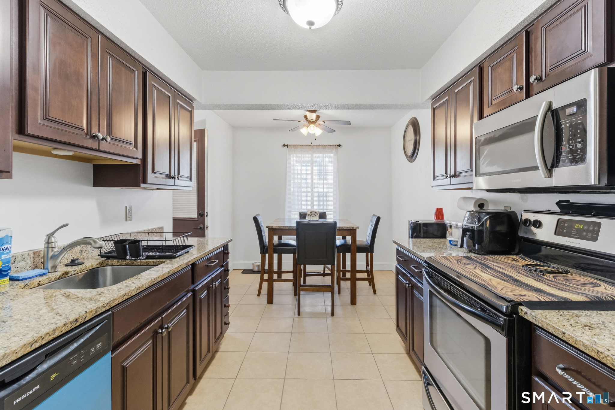 365 Mather Street, Unit 128 Hamden, CT 06514 - Photo 3 of 9 a kitchen with stainless steel appliances granite countertop a sink stove and cabinets