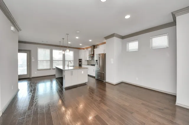 a view of kitchen with furniture and wooden floor