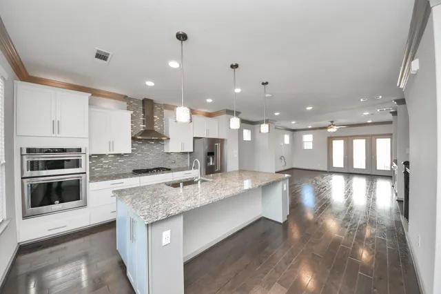 a view of a kitchen with a stove top oven