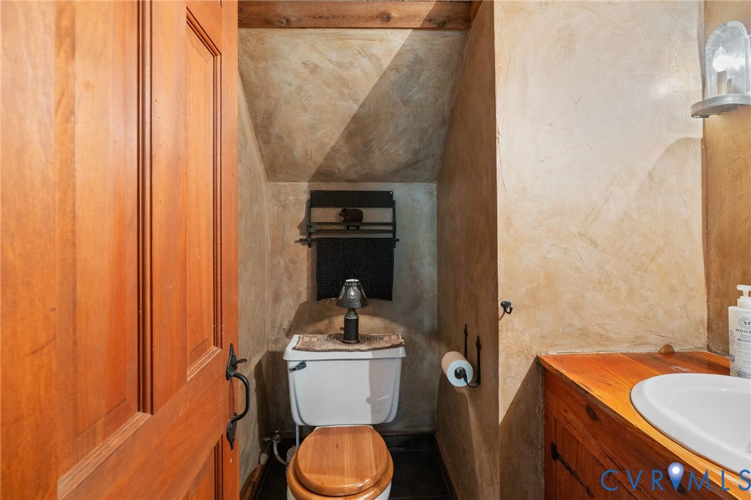 7381 McClellan Road Mechanicsville, VA 23111 - Photo 39 of 66 a bathroom with a sink toilet and shower