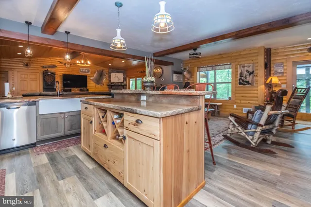 a kitchen with stainless steel appliances granite countertop a lot of counter space