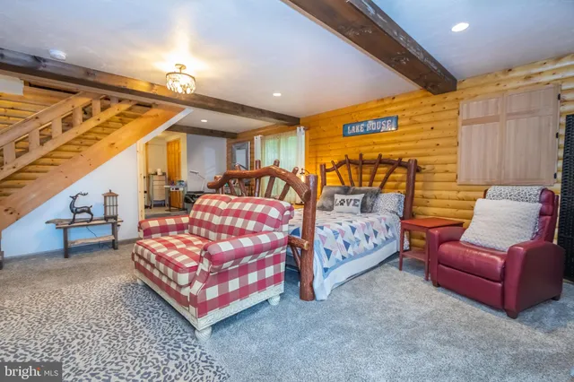 a bedroom with a bed and a couch