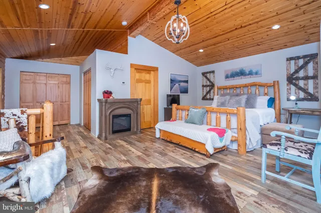 a bedroom with furniture and a fireplace