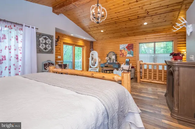 a bed room with a bed and a large window