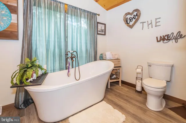 a living room with a toilet and a table