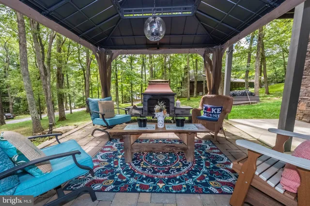 a view of a patio with table and chairs potted plants with wooden floor