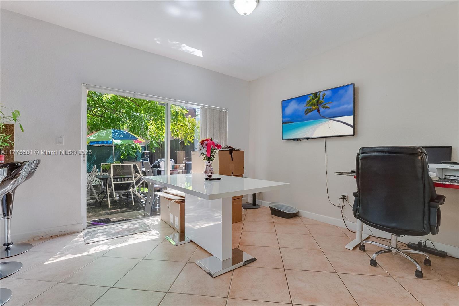 21441 Southwest 85th Path Cutler Bay, FL 33189 - Photo 8 of 17 a workspace with furniture and a window