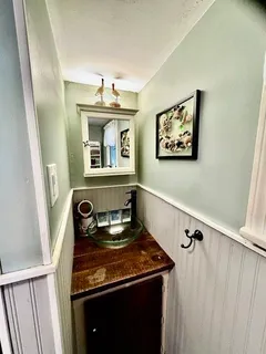 a large bed sitting in a bedroom next to a window