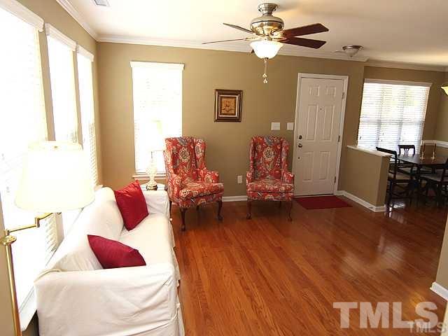 9826 Grettle Court Raleigh, NC 27617 - Photo 3 of 9 a living room with furniture and wooden floor