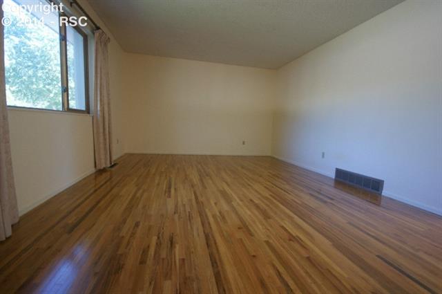 1133 Wooten Road Colorado Springs, CO 80915 - Photo 2 of 21 Living Room