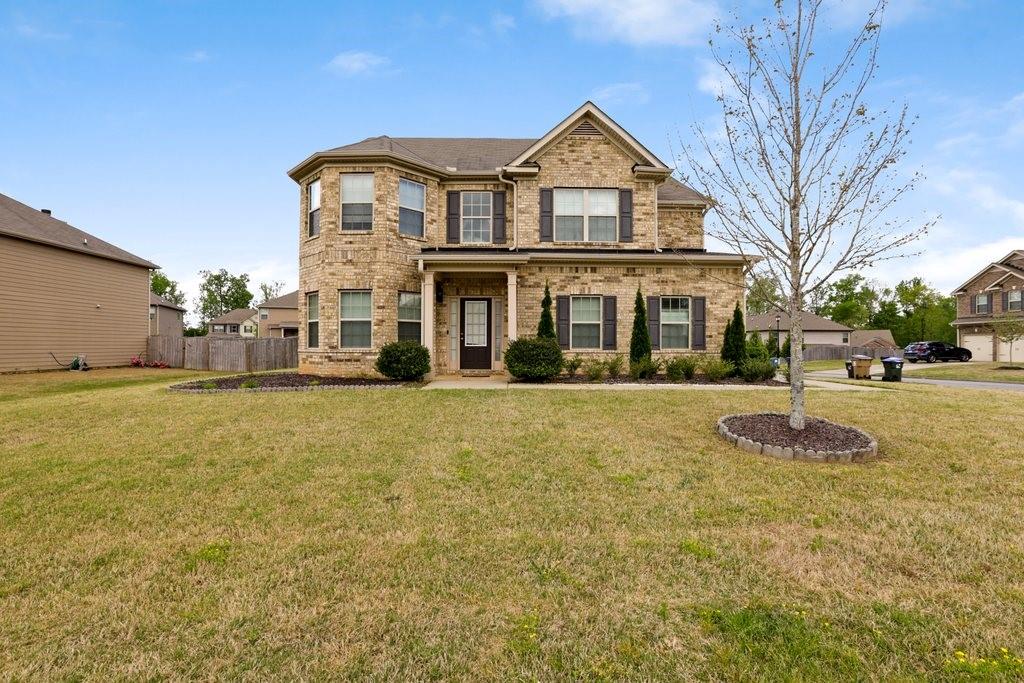 5320 Ripken Road Cumming, GA 30028 - Photo 1 of 1 a front view of a house with a yard