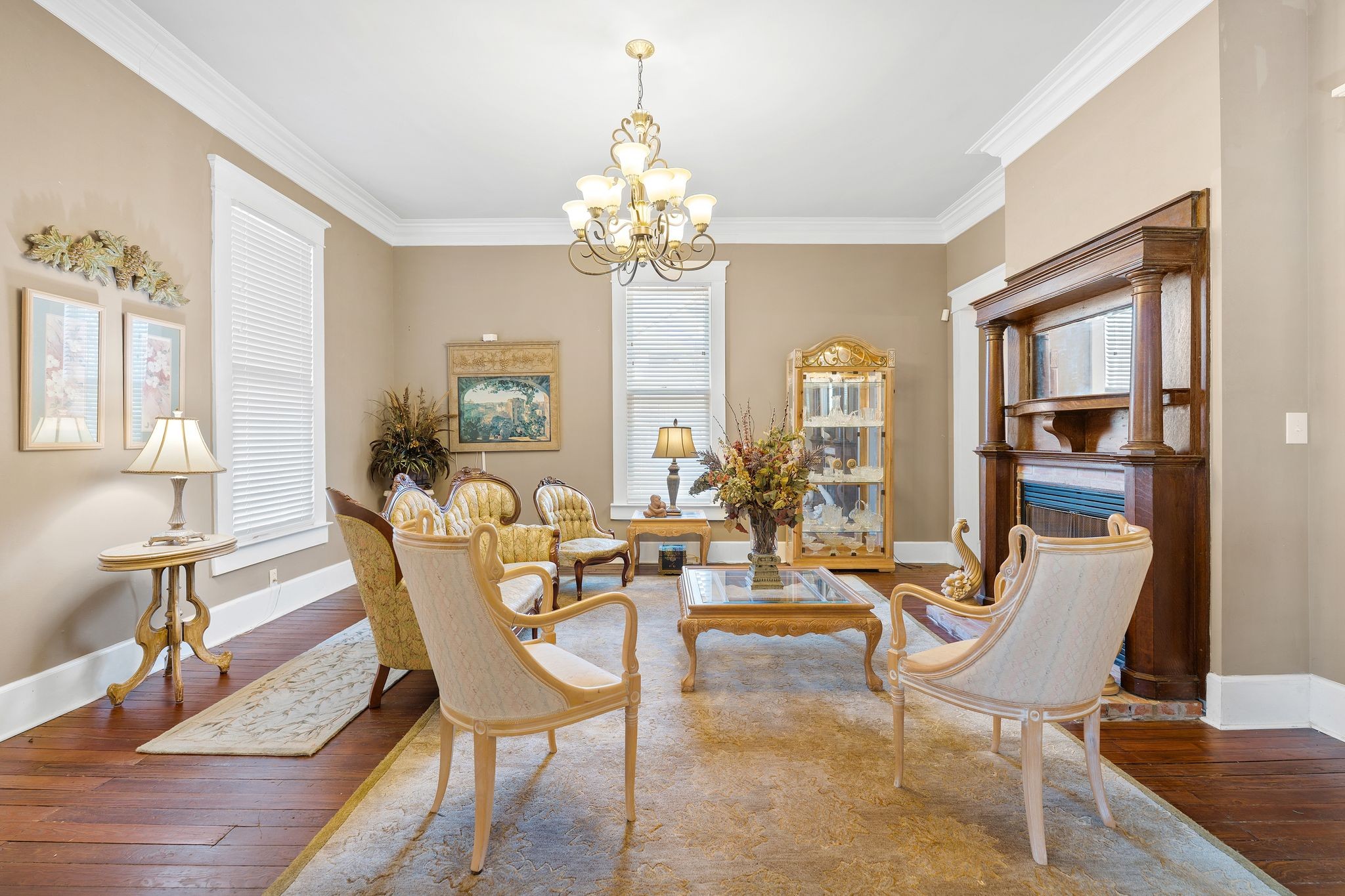 554 East Main Street Jackson, TN 38301 - Photo 11 of 38 a view of a dining room with furniture a chandelier and wooden floor