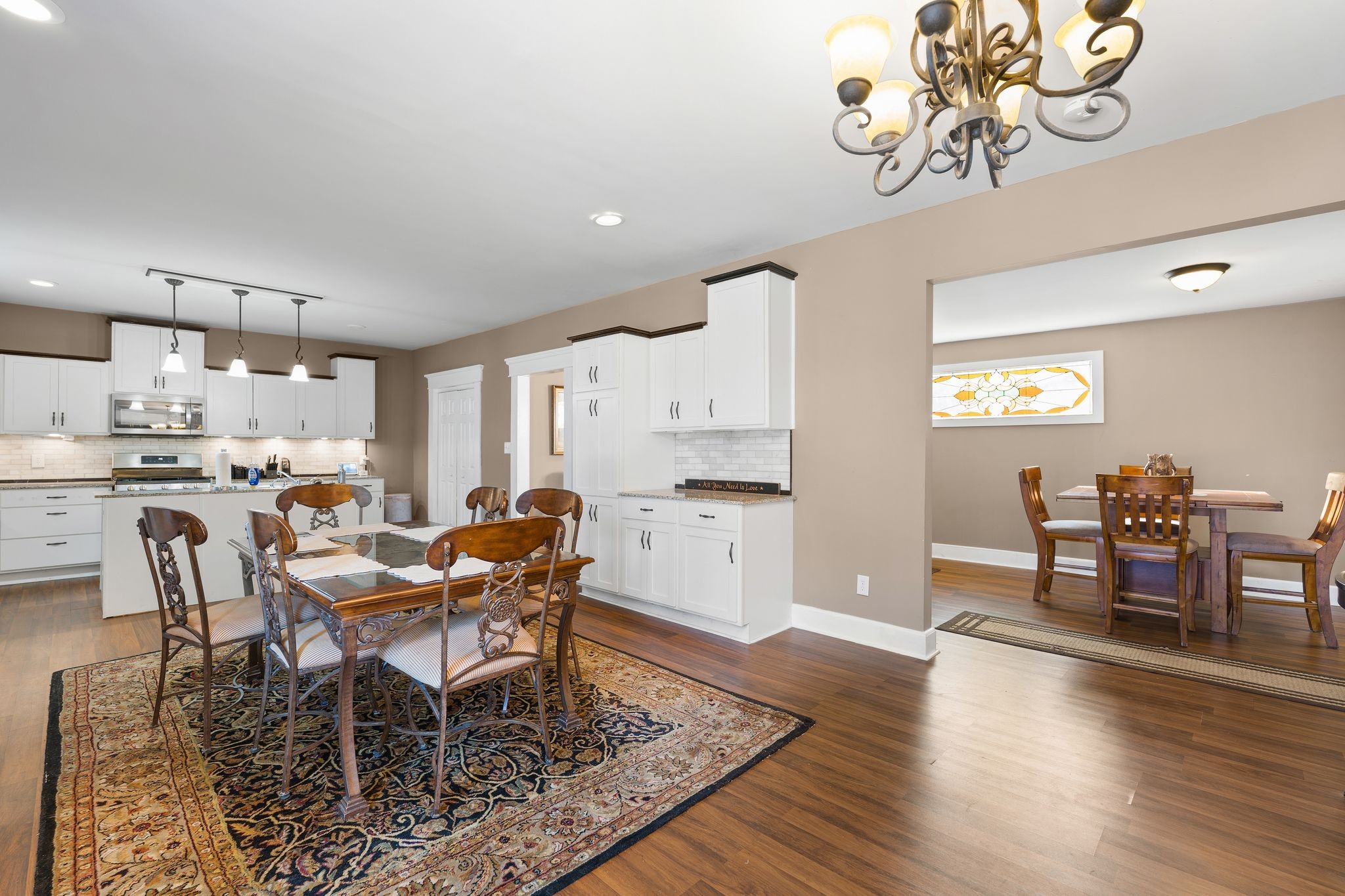 554 East Main Street Jackson, TN 38301 - Photo 14 of 38 a view of a dining room with furniture and wooden floor