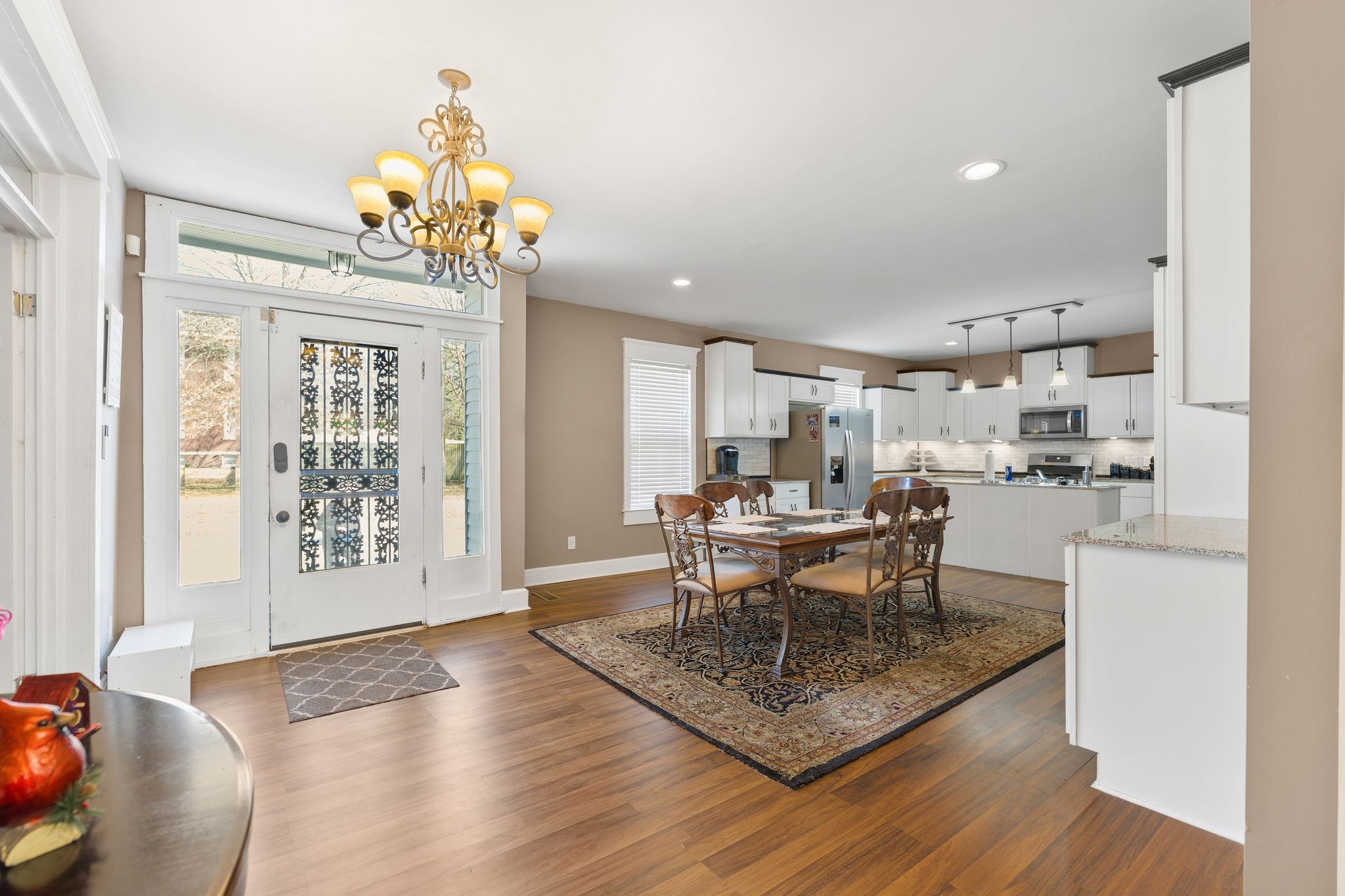 554 East Main Street Jackson, TN 38301 - Photo 15 of 38 a view of a dining room with furniture a chandelier and wooden floor