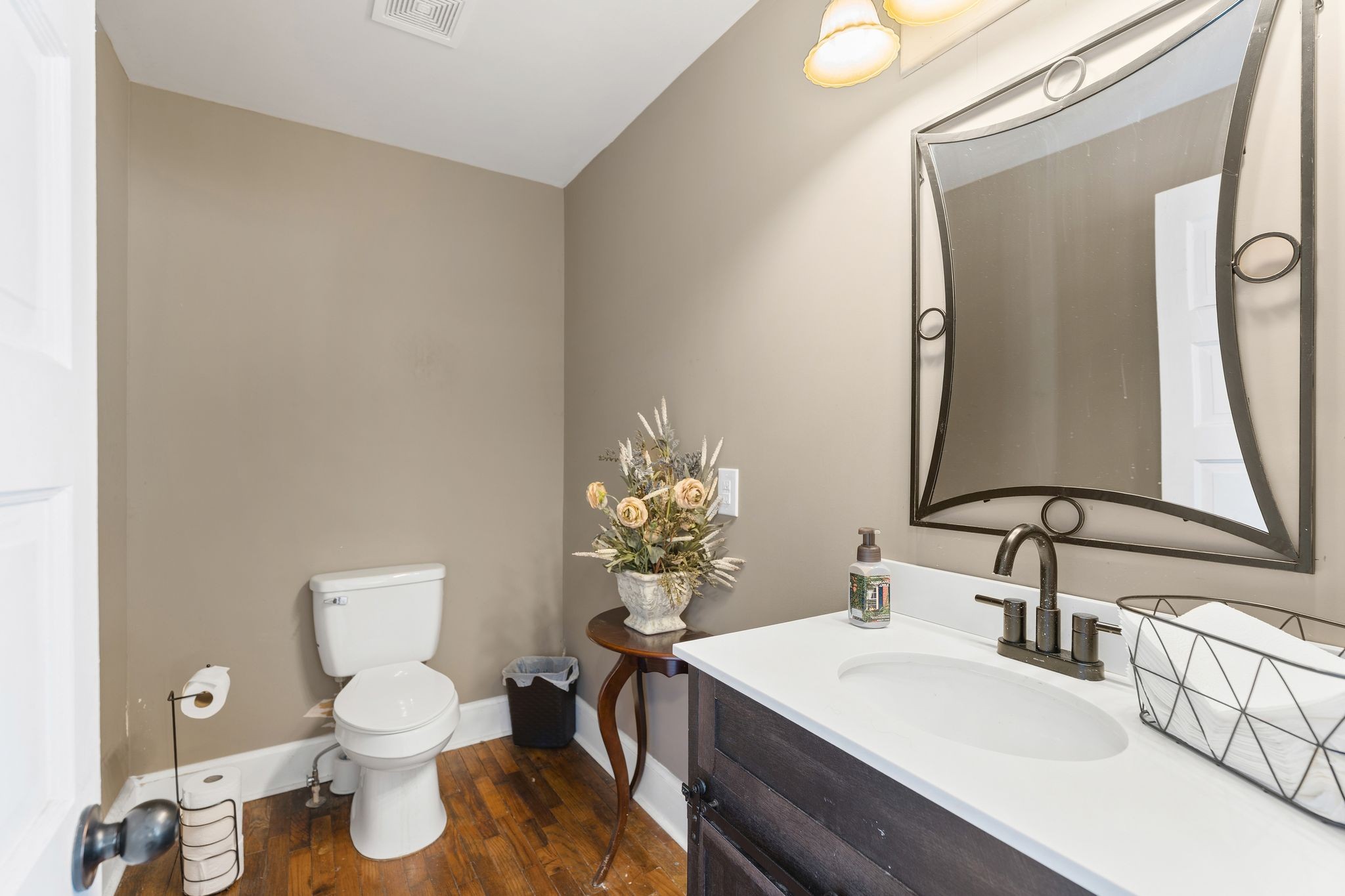 554 East Main Street Jackson, TN 38301 - Photo 18 of 38 a bathroom with a toilet sink and mirror