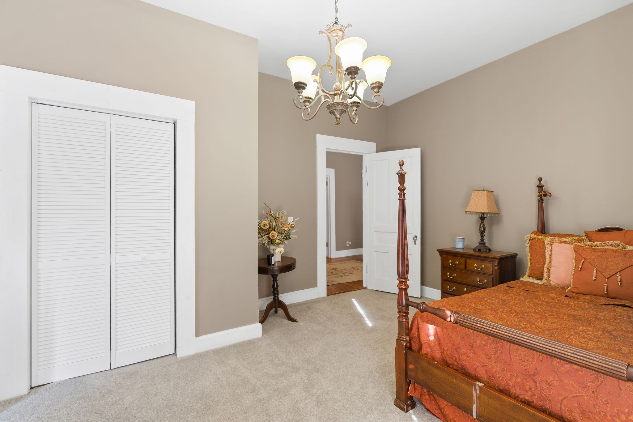 554 East Main Street Jackson, TN 38301 - Photo 25 of 38 a bedroom with a bed and a chandelier