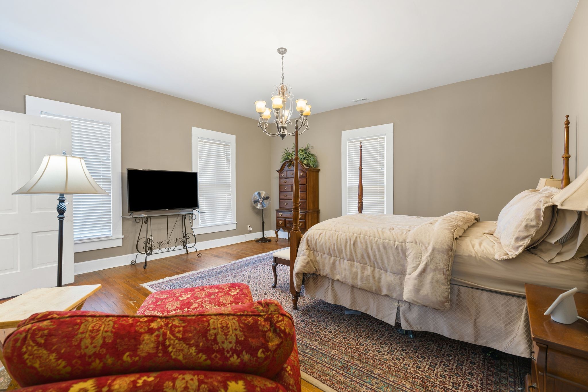 554 East Main Street Jackson, TN 38301 - Photo 28 of 38 a bedroom with a bed and a flat screen tv