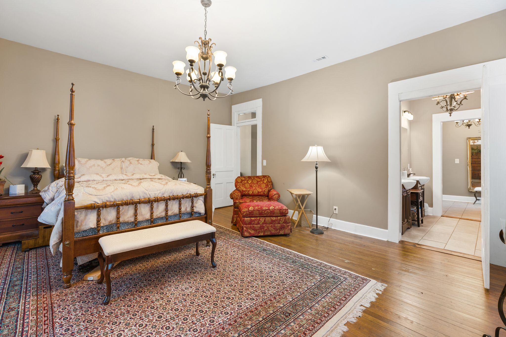 554 East Main Street Jackson, TN 38301 - Photo 29 of 38 a bedroom with furniture and a chandelier